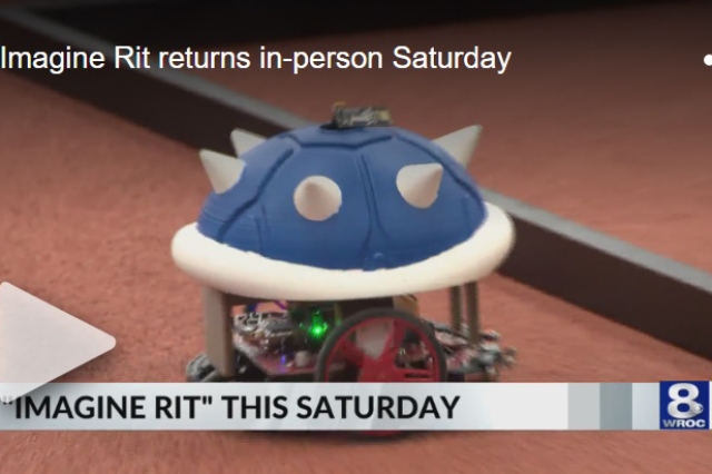 An image of a robot with a blue spiky shell on time with the words "'IMAGINE RIT' THIS SATURDAY" on top and the WROC-TV logo.