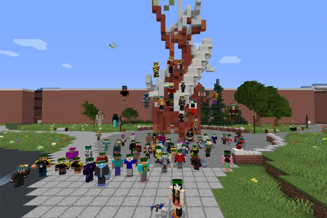 Minecraft characters standing around The Sentinel statue.