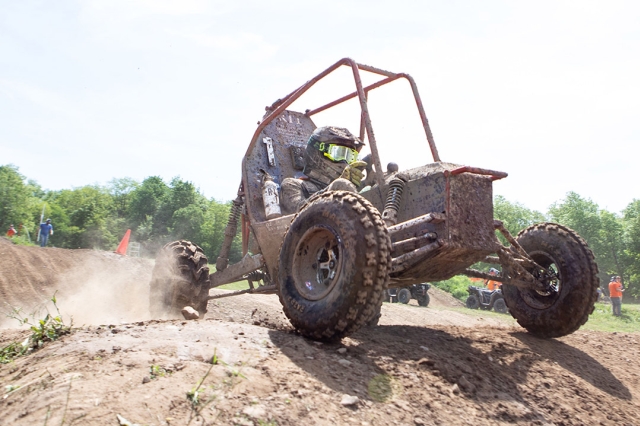 baja car on top of a hill in a racecourse.