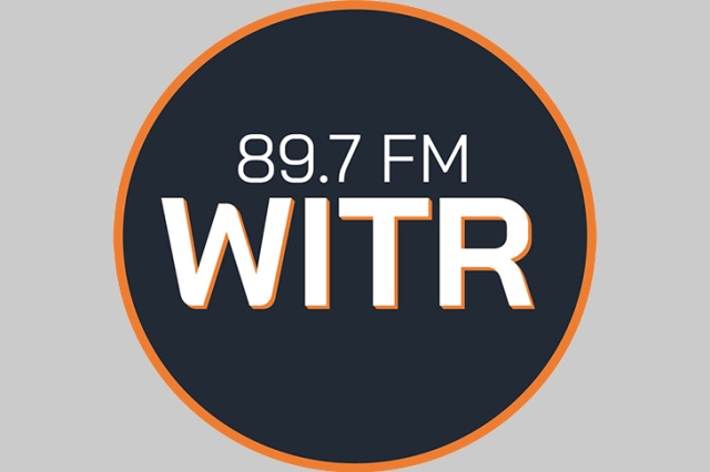 radio station logo with white letters and orange rim