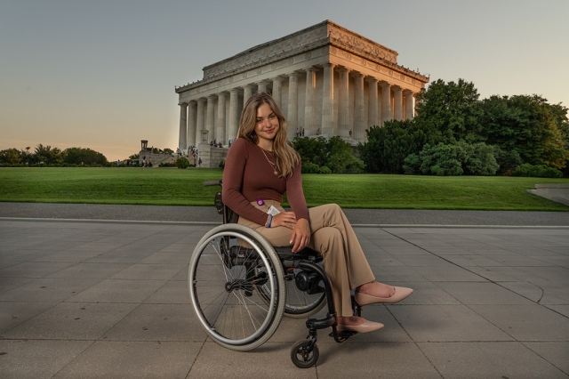 student in a wheelchair in front of the Lincoln Memorial.