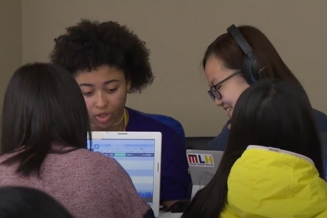 female students working on laptops.