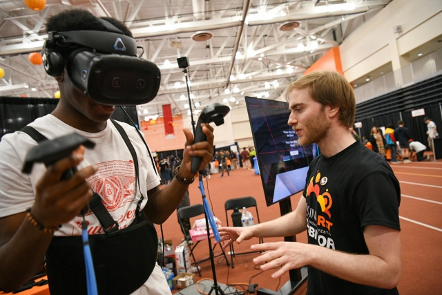 person using a virtual reality headset and hand helds.