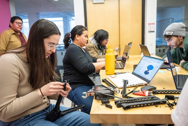 students are shown at a project meeting in Engineering Hall