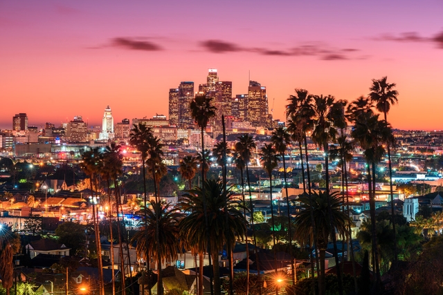 Los Angeles skyline is shown in early evening