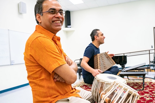 Indian Tabla player Sandeep Das is shown leading a master class with RIT student musicians