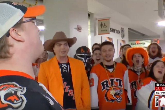 RITs Corner Crew is shown chanting and cheering for RIT.