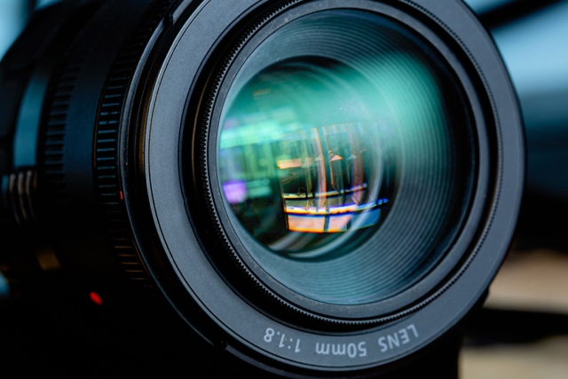 a close up shot of a 50mm lens on a camera.