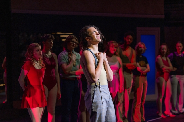 students perform a chorus line musical