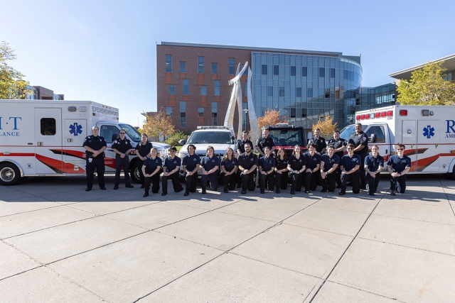 Members of RIT Ambulance pose with their fleet