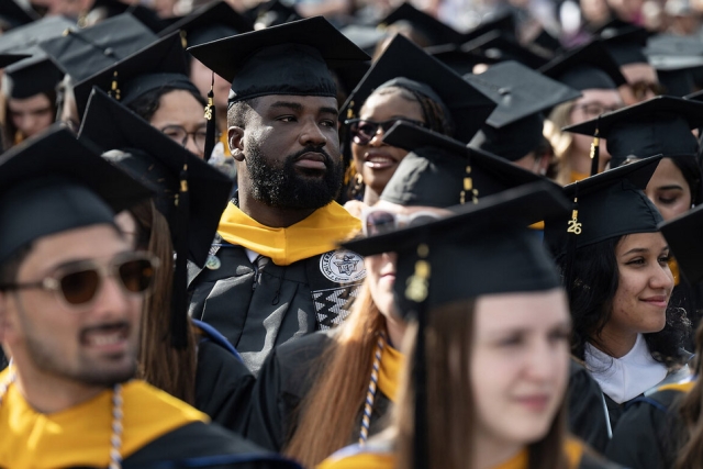 students in a crows wear commencement gear at the University of New Haven in Connecticut