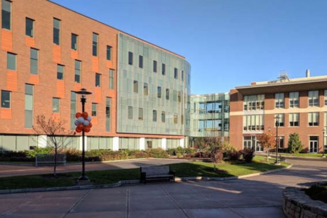 buildings on the R I T c ampus are shown in a sunny day