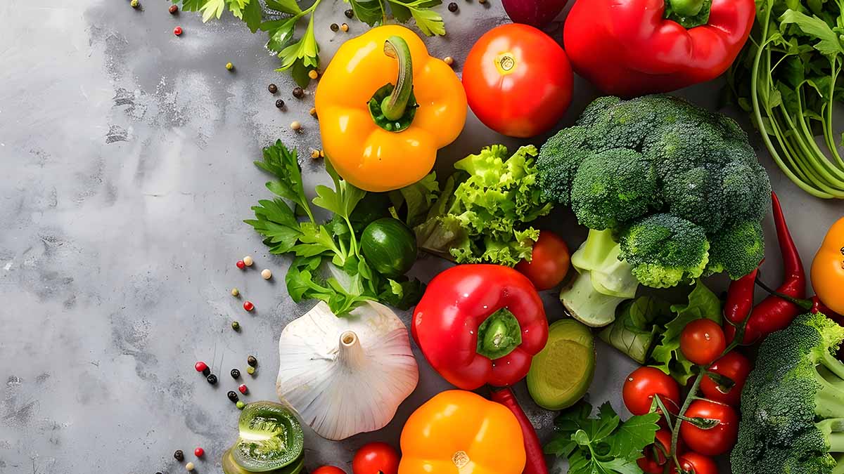 A variety of fruits and vegetables laid out on a surface.