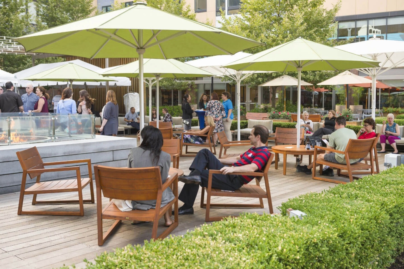 Students sitting outside Global Village enjoying a nice sunny day on campus