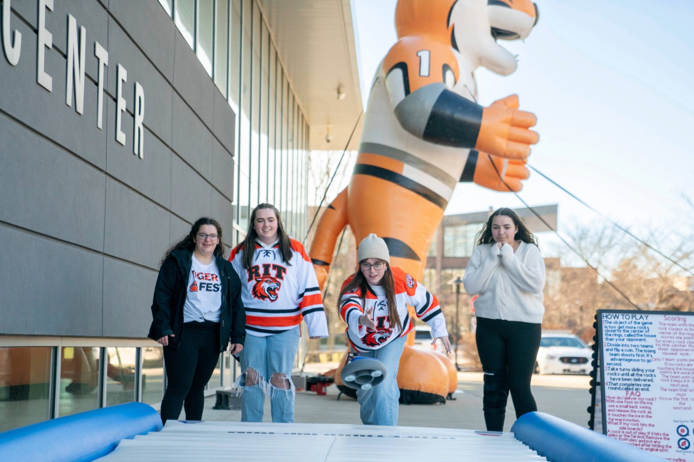 Students playing a game of air hockey during FreezeFest