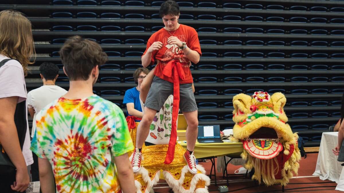 Students from a club showing off their Chinese dragon costume 