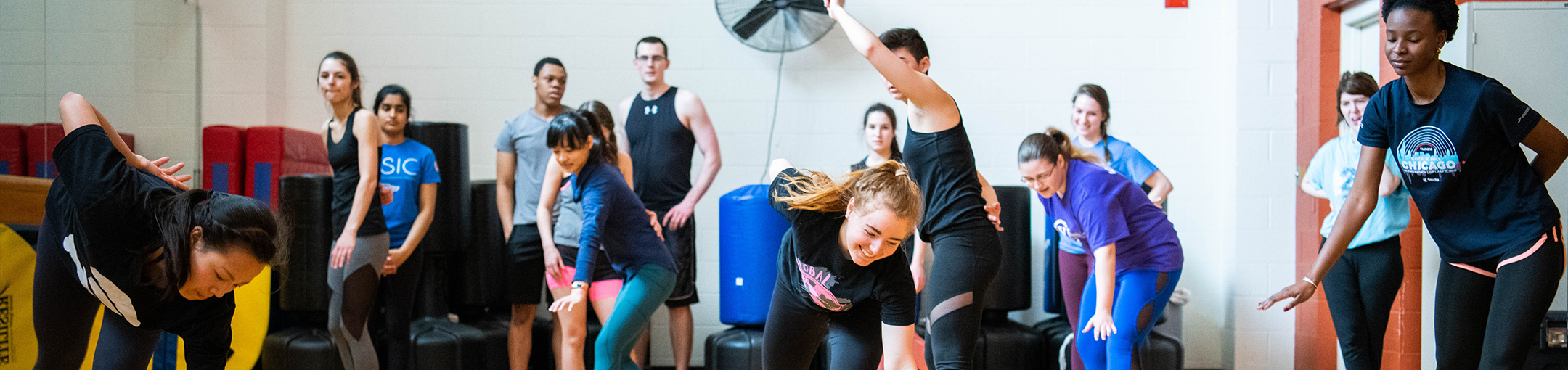 Students participating in a wellness course in an SLC dance studio