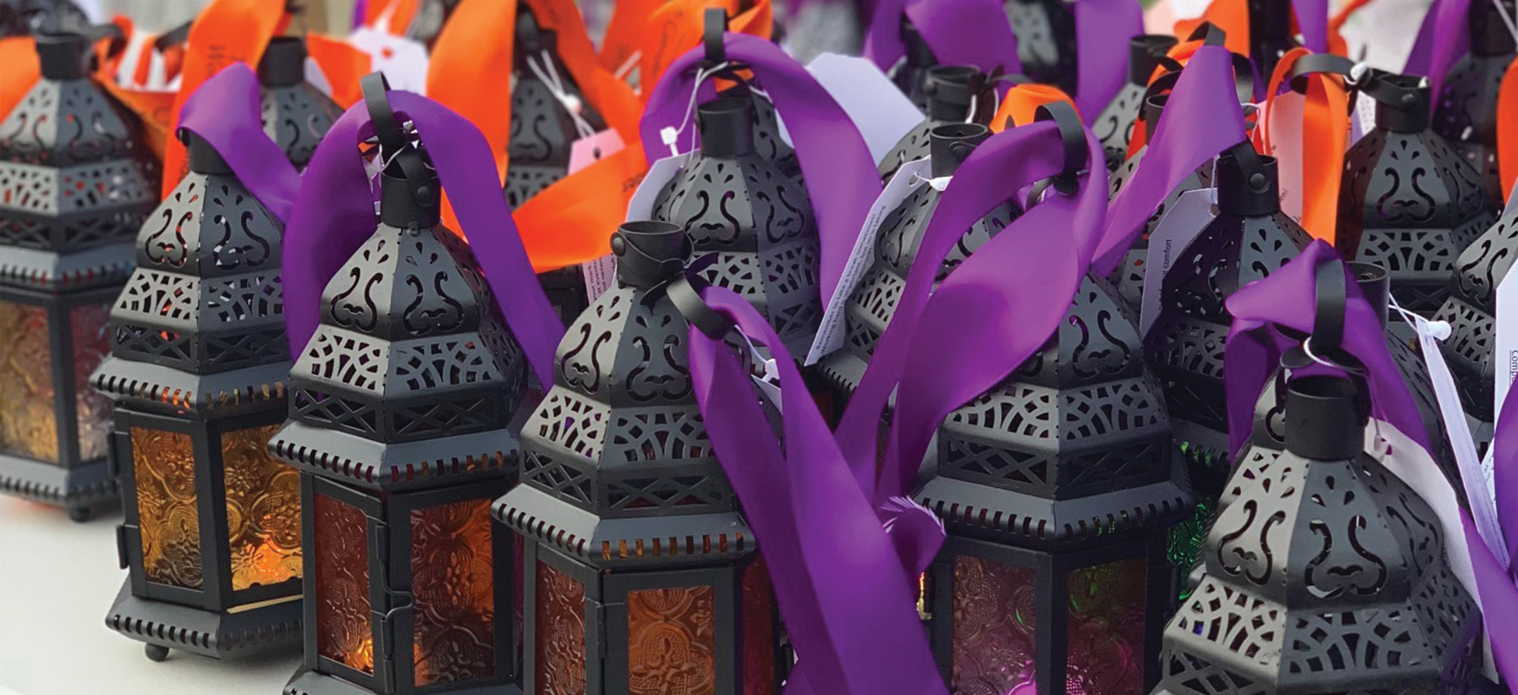 Lanterns with purple and orange ribbons