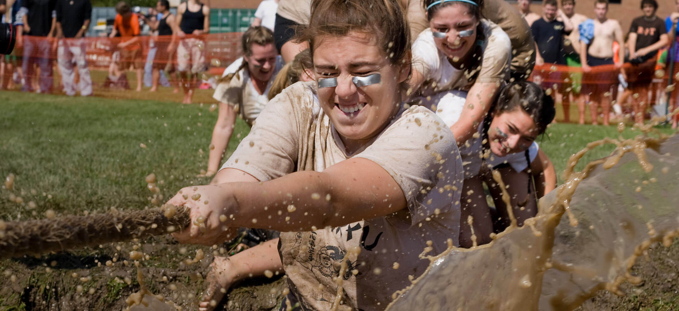 An team being pulled into the mud at mudtug
