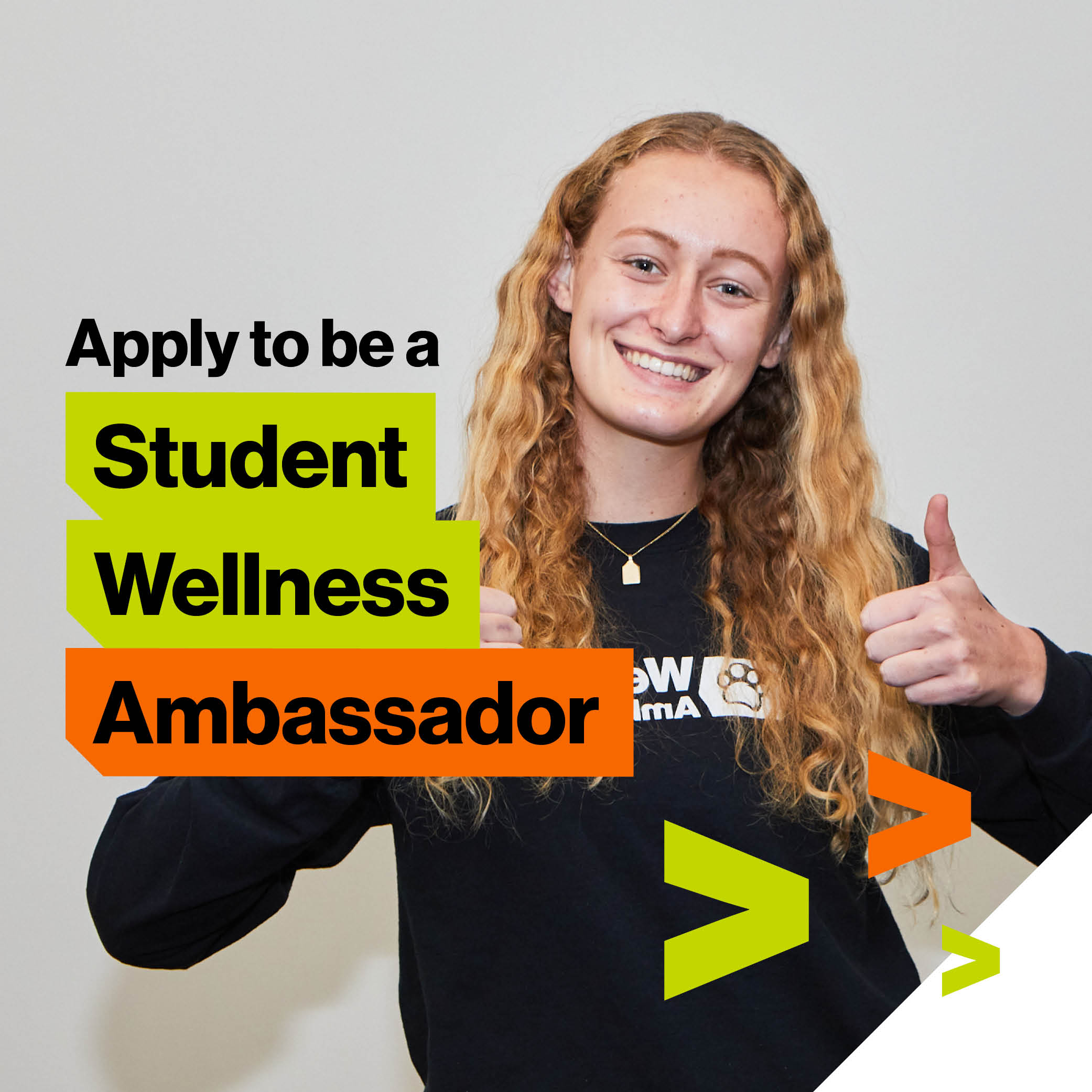 One student wearing a Student Wellness Ambassador t-shirt with Apply to be a Student Wellness Ambassador text