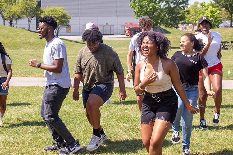 Students dance on the quad during ALANApalooza