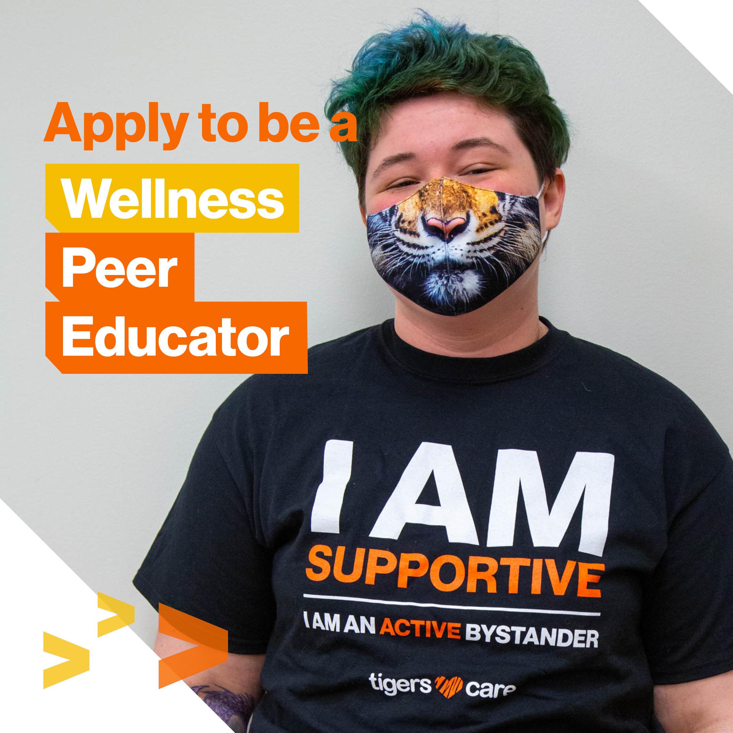 One student wearing a tiger mask and Wellness Peer Educator t-shirt with Apply to be a Wellness Peer Educator text