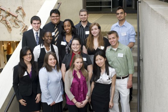 People posing for camera at event