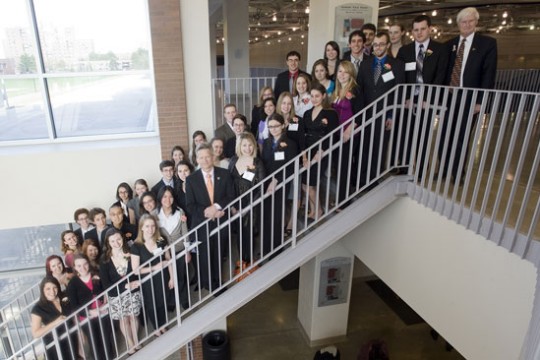 People posing on staircase