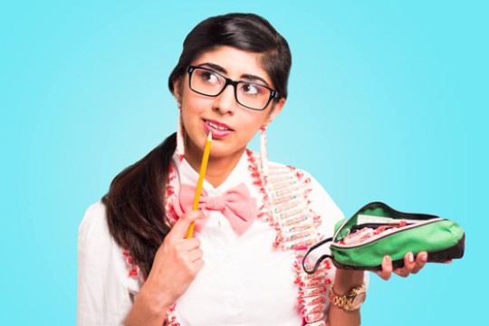 Person posing with pencil and pencil case