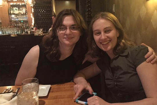 two students out to dinner at a restuarant.