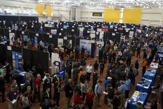 People walking around indoor event