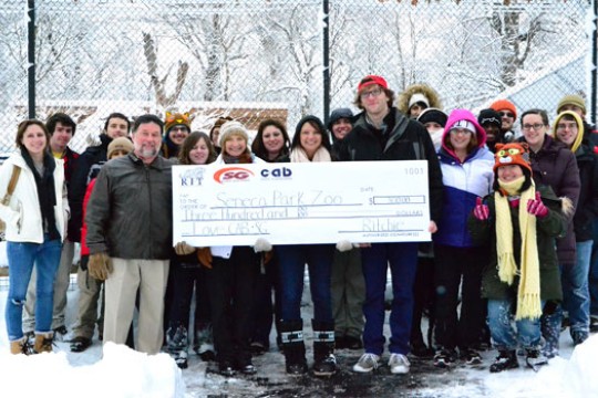 People posing with Check
