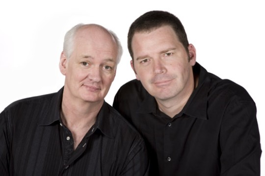 Two people posing for camera