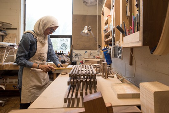 student working on woodworking project.