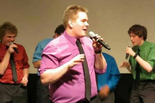 People singing on stage