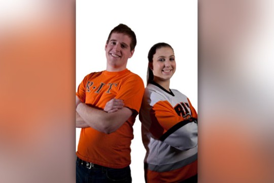 Two people posing for camera