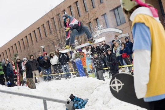 person riding snowboard