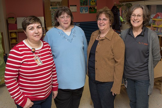 Four teachers posing for camera