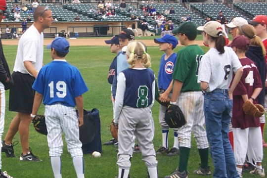 Person coaching kids