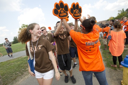 People wearing RIT shirts gathered at event
