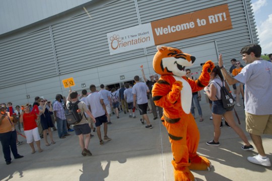 People walking into building