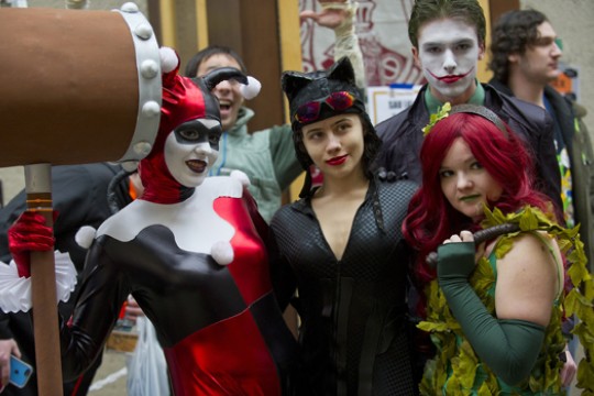 People dressed up in costume posing for camera