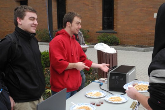 People handing out waffles