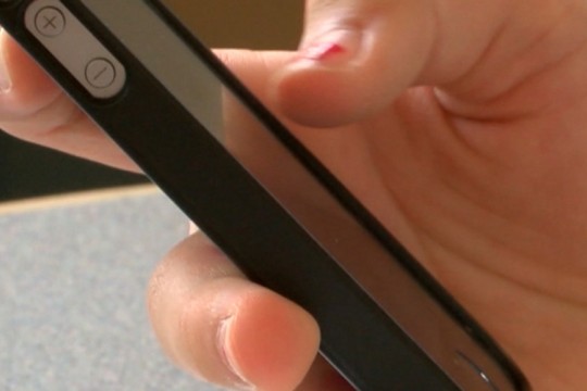 hand holding an iPhone.