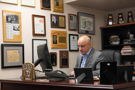 athletic director working in office.
