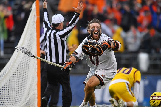 men's lacrosse player celebrates game-winning goal.