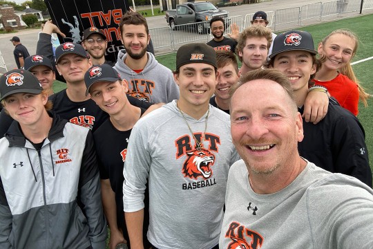 several members of the RIT baseball team posing for a group photo.