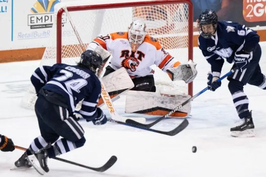 Tommy Scarfone is shown making a save as goalie in a recent game.