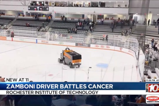 a zamboni appears on the ice at an R I T Hockey game.