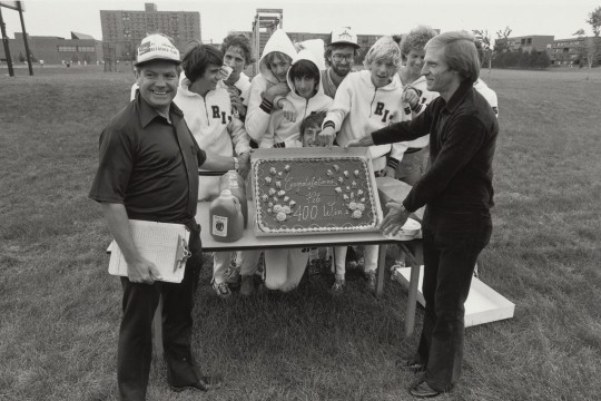 Pete Todd, left, celebrates his 400th win with RIT cross country in 1982